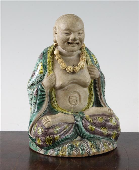 Chinese famille verte glazed biscuit seated figure of Luohan, 18th century(-)